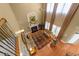 Two-story living room with fireplace, tall windows and draperies, and comfortable seating at 749 Hadrian Dr, Garner, NC 27529
