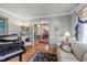 Spacious living room with hardwood floors, sofa, and doorway to dining area at 749 Hadrian Dr, Garner, NC 27529