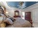 Angled view of the primary bedroom showing the bed, detailed furnishings, and ensuite entrance at 749 Hadrian Dr, Garner, NC 27529