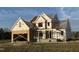 New home under construction, featuring wood framing and a two-car garage at 85 Prency Ln, Middlesex, NC 27557