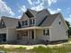 New home under construction featuring neutral siding and a covered front porch at 85 Prency Ln, Middlesex, NC 27557