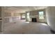 Spacious unfinished living room showing drywall, window placement, and fireplace at 85 Prency Ln, Middlesex, NC 27557