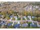 Aerial view of a neighborhood showcasing well-maintained homes and mature trees in a serene setting at 904 Hidden Jewel Ln, Wake Forest, NC 27587