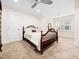 Cozy bedroom featuring soft carpeting, a ceiling fan, and a beautiful wood bed frame at 904 Hidden Jewel Ln, Wake Forest, NC 27587