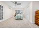 Spacious bedroom features neutral carpeting, a ceiling fan, and soft natural light from the window at 904 Hidden Jewel Ln, Wake Forest, NC 27587