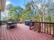 Spacious wooden deck with outdoor furniture and grill, perfect for entertaining and relaxation at 904 Hidden Jewel Ln, Wake Forest, NC 27587