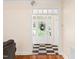 Bright foyer with a checkered floor, white trim, and a view of the front door at 904 Hidden Jewel Ln, Wake Forest, NC 27587