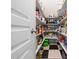 Organized walk-in pantry with tiled floors and ample shelving at 904 Hidden Jewel Ln, Wake Forest, NC 27587