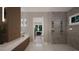 Sleek bathroom featuring a walk-in shower and a double sink vanity with modern fixtures at 95 Cherry Bark Dr, Youngsville, NC 27596