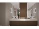 Elegant bathroom with double vanity sinks, modern lighting and fixtures, and generous counter space at 95 Cherry Bark Dr, Youngsville, NC 27596