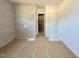 Modern bathroom with tiled shower, a built-in niche, and a view into the closet at 95 Cherry Bark Dr, Youngsville, NC 27596