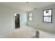 Spacious bedroom features freshly painted white walls and trim, and updated windows at 95 Cherry Bark Dr, Youngsville, NC 27596