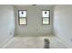 Bright bedroom with two windows offering natural light and views of the surrounding landscape at 95 Cherry Bark Dr, Youngsville, NC 27596