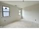 Bright bedroom features freshly painted white walls and trim, and updated black window frames at 95 Cherry Bark Dr, Youngsville, NC 27596