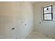 Unfinished bedroom with a large window providing natural light at 95 Cherry Bark Dr, Youngsville, NC 27596