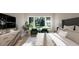 Bright bedroom with a large window, flat screen TV, modern decor and comfortable furniture at 95 Cherry Bark Dr, Youngsville, NC 27596