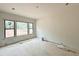 Bright bedroom with large windows offering ample natural light and scenic outdoor views at 95 Cherry Bark Dr, Youngsville, NC 27596