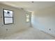 Bright bedroom features modern black frame windows and neutral walls at 95 Cherry Bark Dr, Youngsville, NC 27596