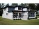 Beautiful two-story home featuring a mix of siding, stone veneer and front porch seating at 95 Cherry Bark Dr, Youngsville, NC 27596