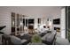 Elegant living room with an outdoor view, a fireplace, and comfortable seating at 95 Cherry Bark Dr, Youngsville, NC 27596