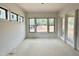 Bright open room with natural light, large windows, and access to the backyard at 95 Cherry Bark Dr, Youngsville, NC 27596