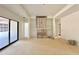 Bright living room featuring a modern fireplace and floor-to-ceiling shelving and sliding glass door at 95 Cherry Bark Dr, Youngsville, NC 27596