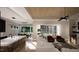 Open concept living space featuring a modern kitchen, dining area, and living room with ample natural light at 95 Cherry Bark Dr, Youngsville, NC 27596