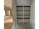 Spacious pantry with white shelving provides ample storage space for an organized kitchen at 95 Cherry Bark Dr, Youngsville, NC 27596