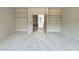 Spacious room offers built in shelves and a doorway to another part of the house at 95 Cherry Bark Dr, Youngsville, NC 27596