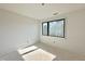 Room with neutral walls and large black frame window at 95 Cherry Bark Dr, Youngsville, NC 27596