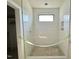 Modern shower with white subway tile walls and recessed shower caddy at 95 Cherry Bark Dr, Youngsville, NC 27596