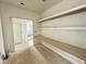 Mudroom with built-in bench and open shelving offers ample storage and organization at 95 Cherry Bark Dr, Youngsville, NC 27596