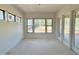 Bright sunroom with large windows providing abundant natural light and outdoor views at 95 Cherry Bark Dr, Youngsville, NC 27596