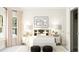 Bright bedroom featuring decor, neutral walls, patterned rug, and large windows at 300 Calvander Ln, Apex, NC 27539