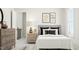 Well-lit bedroom featuring a neutral color palette, comfortable bed, and decorative accents for a cozy feel at 300 Calvander Ln, Apex, NC 27539