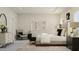Bright bedroom with a cozy armchair, modern dresser, and stylish decor for comfortable living at 300 Calvander Ln, Apex, NC 27539