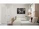 Inviting bedroom showcasing two beds, accented with lamps, and a calm, airy ambiance at 300 Calvander Ln, Apex, NC 27539