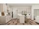 Bright kitchen with stainless steel appliances, light countertops, and pendant lighting at 300 Calvander Ln, Apex, NC 27539