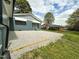 Spacious backyard features gravel, green lawn, and well-maintained landscaping at 1 Greenfield Ct, Durham, NC 27705