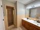 Bathroom showcasing the shower and double sink vanity at 1 Greenfield Ct, Durham, NC 27705