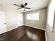 Bright bedroom with hardwood floors, neutral paint, and a ceiling fan at 1 Greenfield Ct, Durham, NC 27705
