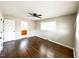 Bedroom with hardwood floors, closet, and windows offering ample natural light at 1 Greenfield Ct, Durham, NC 27705