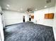 Large bonus room features bright recessed lights, ample space, and door to hallway and the exterior at 1 Greenfield Ct, Durham, NC 27705