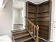 Inviting hallway features hardwood floors and convenient built-in shelving, adding charm and functionality at 1 Greenfield Ct, Durham, NC 27705