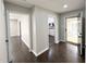 Hallway view showcasing the home's layout, connecting the living spaces with hardwood floors throughout at 1 Greenfield Ct, Durham, NC 27705