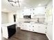 Updated kitchen featuring white cabinets, stainless steel appliances, and granite countertops at 1 Greenfield Ct, Durham, NC 27705