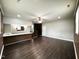 Living room with bar seating area and stair access at 1 Greenfield Ct, Durham, NC 27705