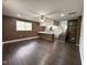 Open concept living room featuring modern flooring, paneled accent walls, and bright lighting at 1 Greenfield Ct, Durham, NC 27705