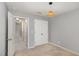 The bedroom features a large window, a pendant light and a built in closet at 102 Bella Pl, Holly Springs, NC 27540