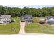 Spacious property with fenced yard, mature trees, and a peek of the lake at 112 Roping Horn Way, Willow Springs, NC 27592